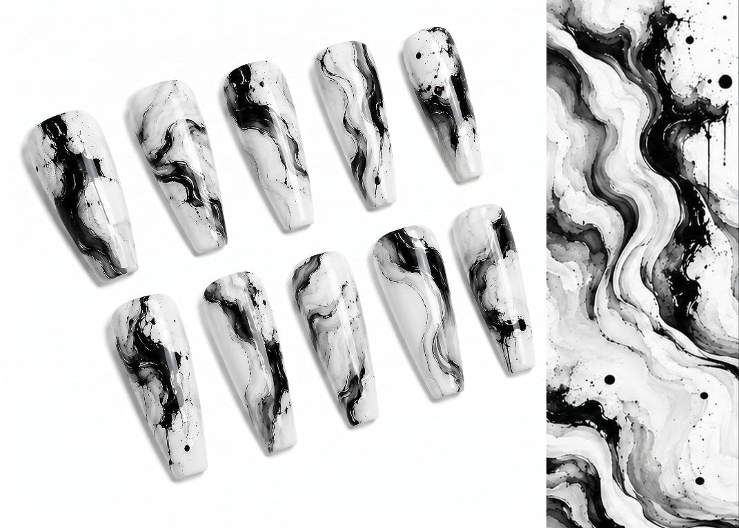 Marble-patterned nails with black and white swatches on a white background