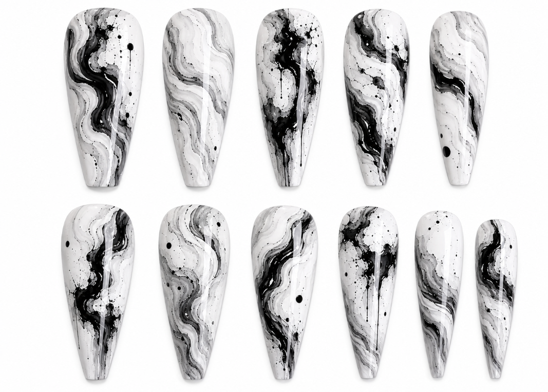 Set of black and white marbled nail art designs on a white background