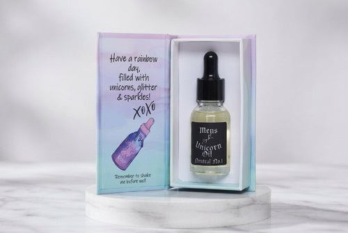 15ml glass bottle of Men's Neutral No.1 Cuticle Oil displayed elegantly inside its magnetic luxury style gift box, showcasing a premium, shimmer-free serum.