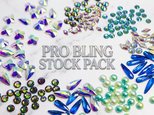 Collection of colorful rhinestones with 'Pro Bling Stock Pack' text on a marble background