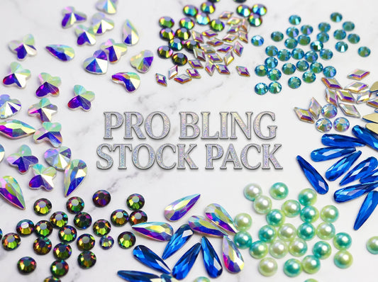 Collection of colorful rhinestones with 'Pro Bling Stock Pack' text on a marble background