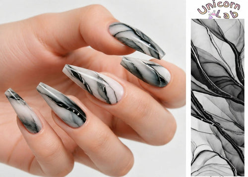Hand with marbleized black and white nails, with 'Unicorn Lab' branding.