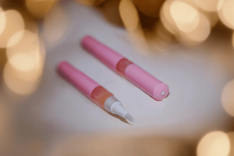 Vanilla Spice & Everything Nice Unicorn Cuticle Oil Pen in a white surface. Part of the Unicorn Oil catalog