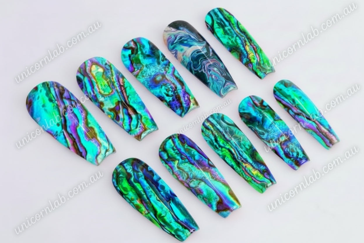 Abalone Waterslide Decal displayed on a set of coffin shaped nails