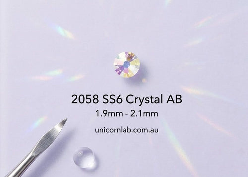 Crystal AB gemstone with size specifications on a clear stand against a light purple background. ab swarovski ss6