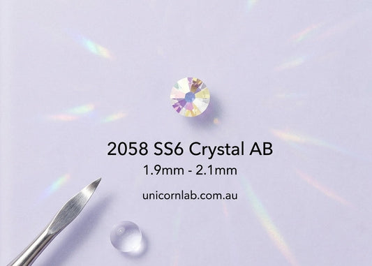 Crystal AB gemstone with size specifications on a clear stand against a light purple background. ab swarovski ss6