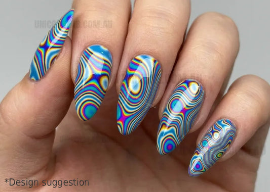 Hand with colorful swirl nail art on a neutral background