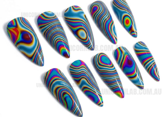Multicolored, wavy nail art designs on a white background