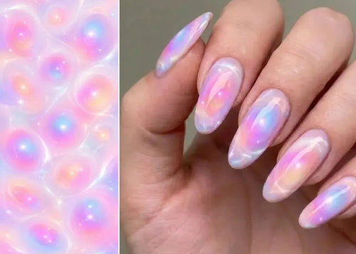Nail art with a gradient of pink, purple, and blue on a neutral background