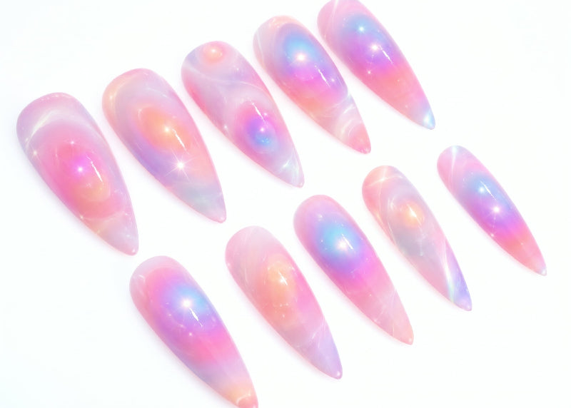 Set of iridescent nail art tips on a white background