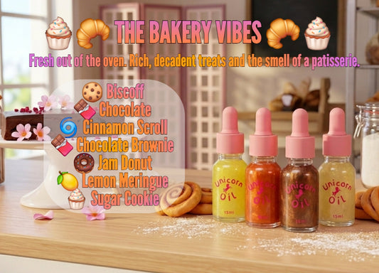 Bakery-themed display with colorful bottles labeled 'Unicorn Oil' and pastries on a wooden surface.