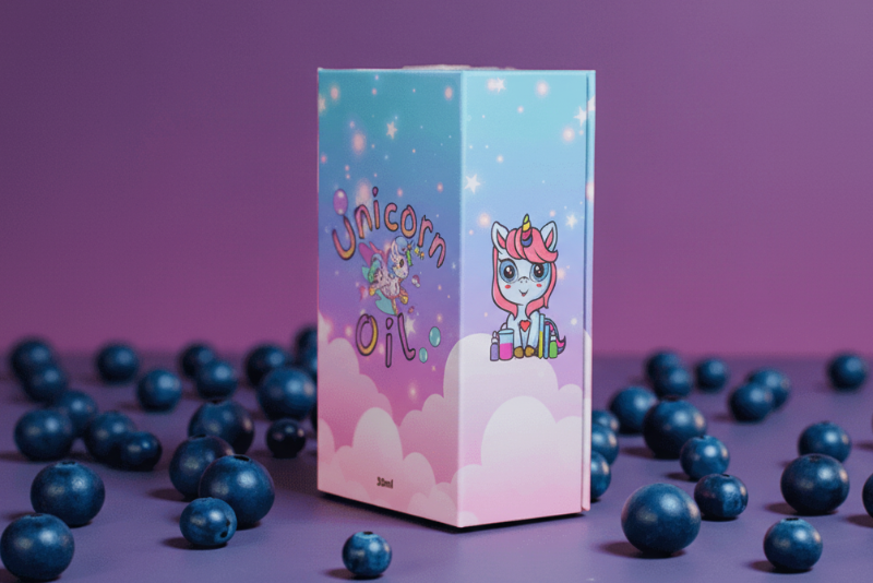 Box labeled 'Unicorn Oil' with a cartoon unicorn on a purple background with blueberries around.