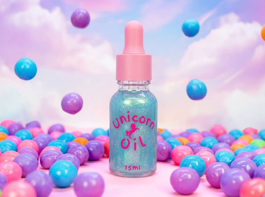 A bubblegum scented 15ml cuticle oil in a dropper bottle. From the largest range of cuticle oils by Unicorn Lab surrounded by colourful gumballs