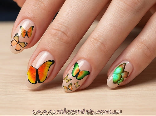 Nails with butterfly designs on a wooden surface, featuring the brand 'www.unicornlab.com.au'.