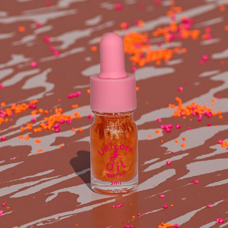 Chocolate Unicorn Cuticle Oil - Unicorn Lab - a 5ml scented nail serum over a chocolate drizzle background