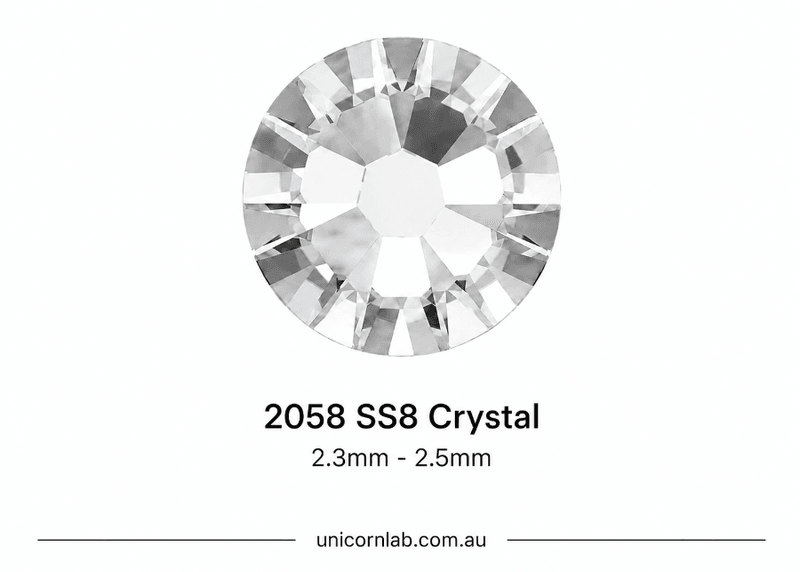 Crystal stone labeled '2058 SS8 Crystal' with size range '1.9mm - 2.1mm' on a white background. SS8 Crystal Flatback Nail Crystals | Genuine 2025 Rhinestones