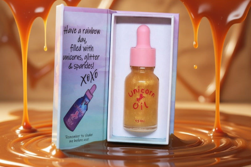 Unicorn oil bottle in a box with a rainbow-themed message on a caramel background