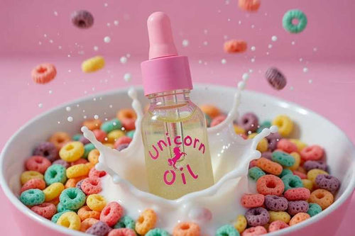 Fruit Loops scented cuticle oil splashing into a bowl of cereal and milk, colourful scented nail serum concept