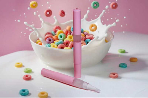 Fruit Loops cuticle oil pen splash in cereal bowl with milk, sweet scented nail serum for dry nails
