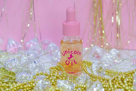 5ml glass bottle of Golden Hour Unicorn Cuticle Oil showcasing a premium nail 