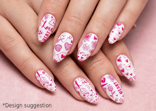 Nails with pink and white heart-themed nail art on a pink background
