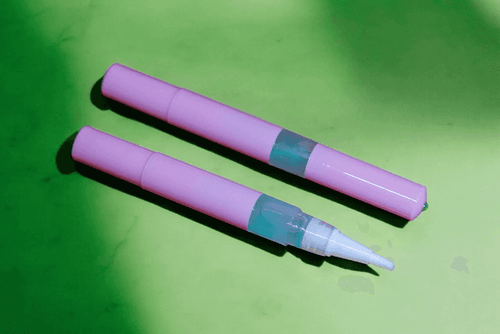 Killer Python Unicorn Cuticle Oil  Pen- on a green background