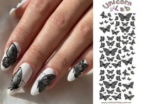 Nails with black butterfly design and a sheet of butterfly stickers on the side, branded 'Unicorn Lab'.