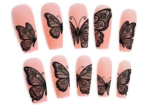 Nail art stickers with black butterfly designs on pink nail models.