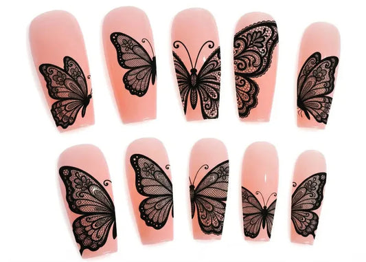 Nail art stickers with black butterfly designs on pink nail models.