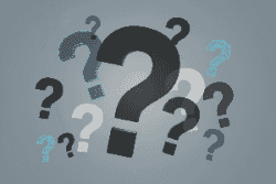 Various question marks on a gray background