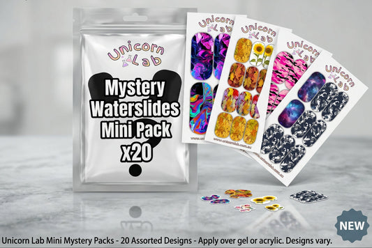 Unicorn Lab Mystery Waterslides Mini Pack with assorted nail art designs on a gray surface.