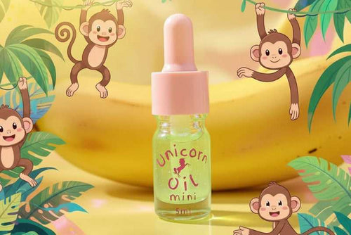 5ml glass dropper bottle pen of Monkey Farts Unicorn Cuticle Oil featuring a tropical shimmering liquid. 12 free cuticle oil