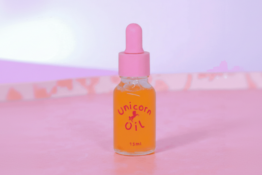 15ml glass dropper bottle of Passionfruit & PawPaw Unicorn Cuticle Oil featuring shimmering tropical-scented oil and a boutique label.