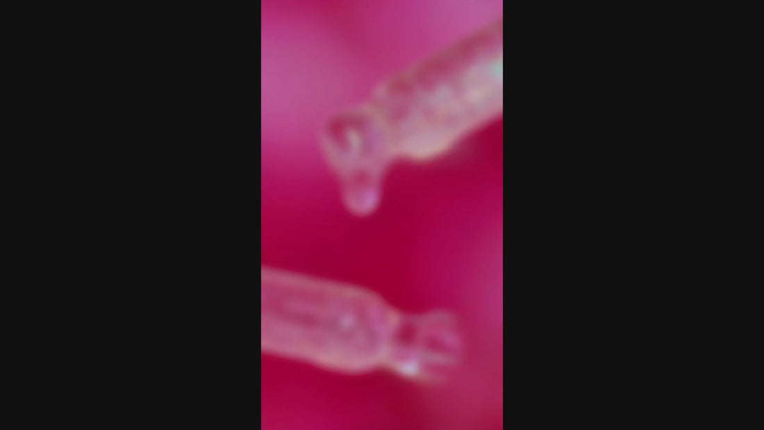 a visual of cuticle oil dripping out o a dropper
