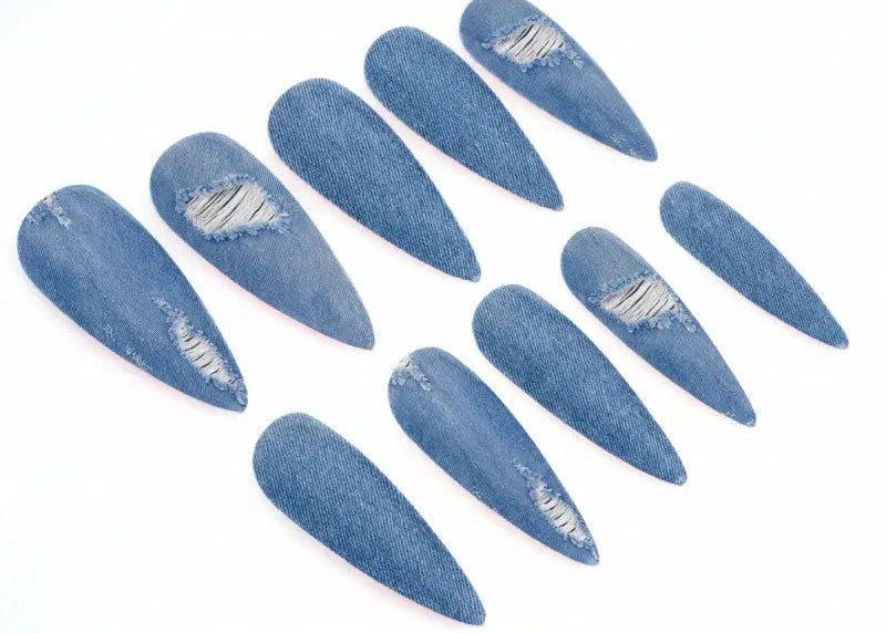Set of blue denim-style nail art stickers on a white background
