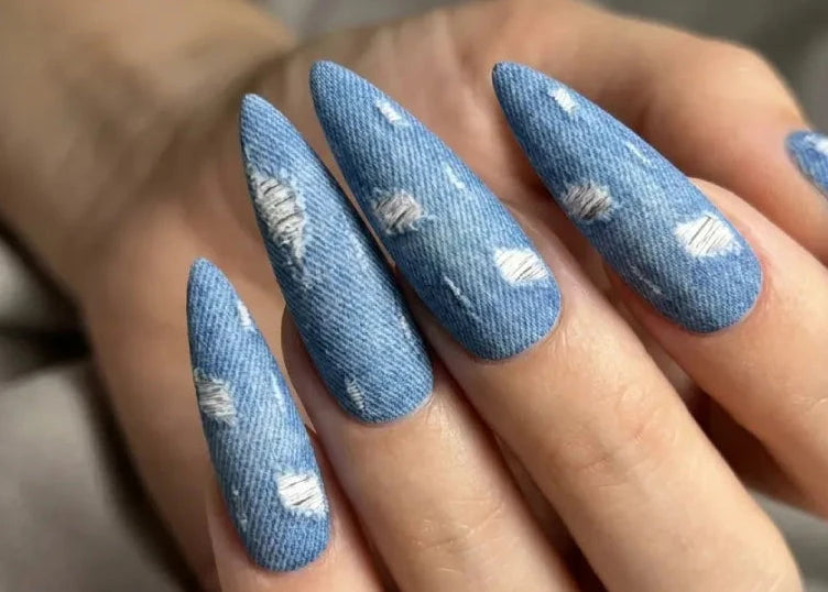 Ripped denim waterslide nail decals on long stiletto nails
