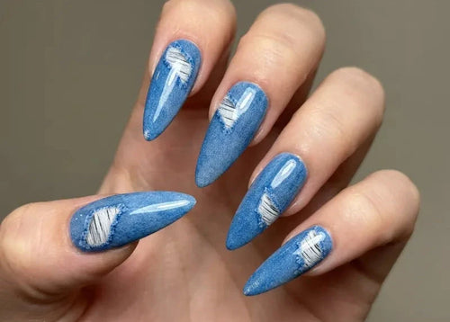Ripped denim waterslide nail decals on long stiletto nails