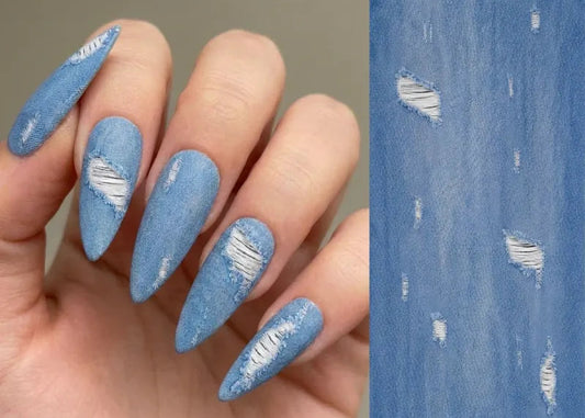 Blue distressed nail design on a hand with a close-up of the pattern on the right.
