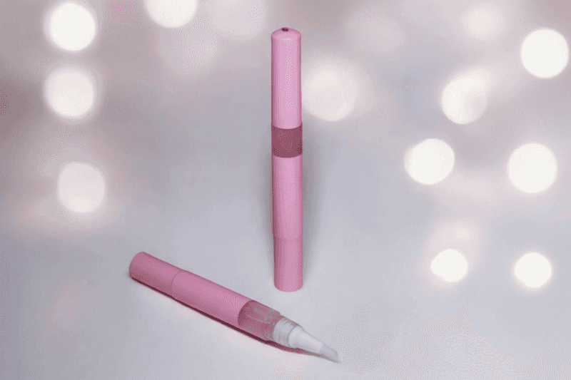 3ml twist cuticle oil pen of the Sugar Cookie Unicorn Cuticle Oil, showing a shimmering, golden bakery-scented serum.