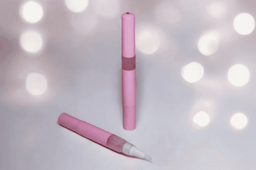 3ml twist cuticle oil pen of the Sugar Cookie Unicorn Cuticle Oil, showing a shimmering, golden bakery-scented serum.