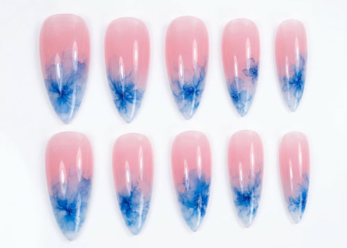 Set of pink and blue gradient nail art designs on a white background