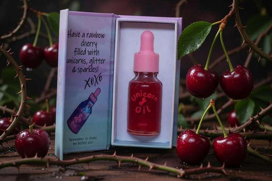 cherry scented nail serum in a glass dropper bottle and magnetic gift box