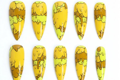 Set of yellow and brown nail art designs on a white background