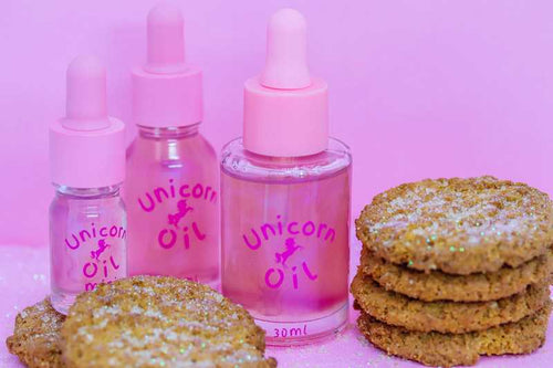 5ml, 15ml & 40ml glass dropper bottle of Sugar Cookie Unicorn Cuticle Oil, showing a shimmering, golden bakery-scented serum.