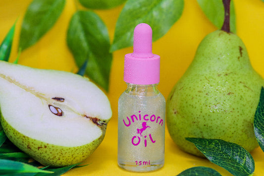 15ml dropper bottle of the luxury French Pear Unicorn Cuticle Oil serum for professional salons.