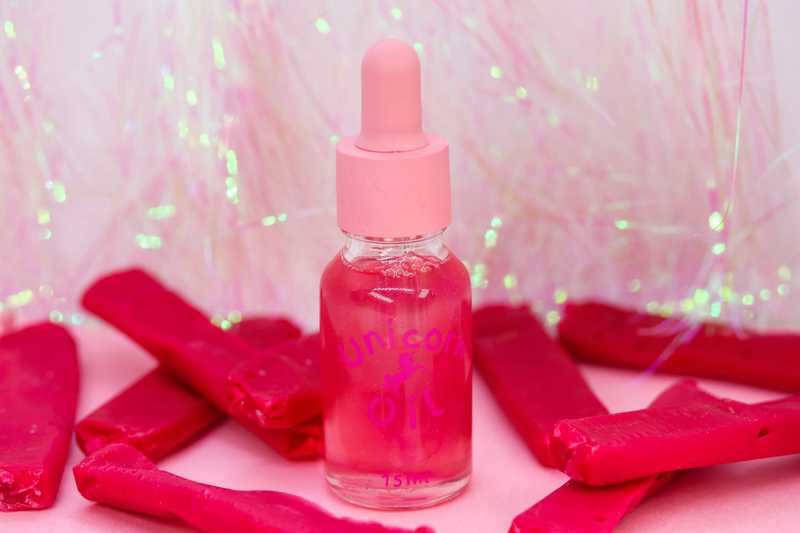 Red Skin cuticle oil surrounded by red lollies, sweet scented nail serum product image