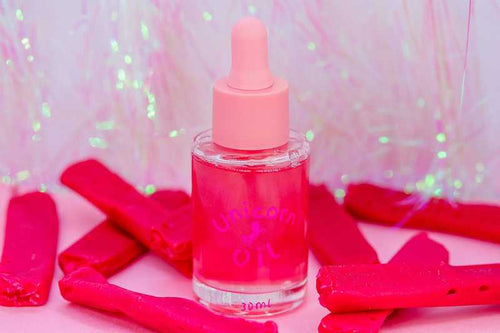 Sweet red lollies with Red Skin cuticle oil, playful scented nail serum product shot