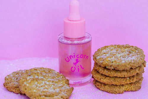 15ml glass dropper bottle of Sugar Cookie Unicorn Nail serum, showing a shimmering, golden bakery-scented serum.