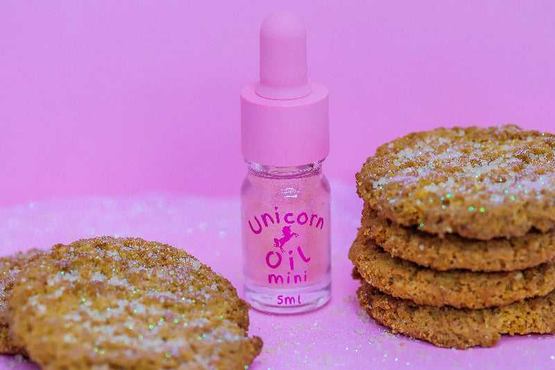 5ml glass dropper bottle of Sugar Cookie Unicorn Cuticle Oil, showing a shimmering, golden bakery-scented serum.